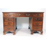 A late 19th century mahogany twin pedestal desk,