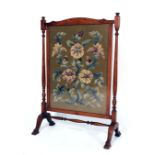 An early 20th century mahogany and tapestry firescreen, with an ivorine label verso for A.