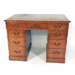 A late 19th century mahogany twin pedestal desk,