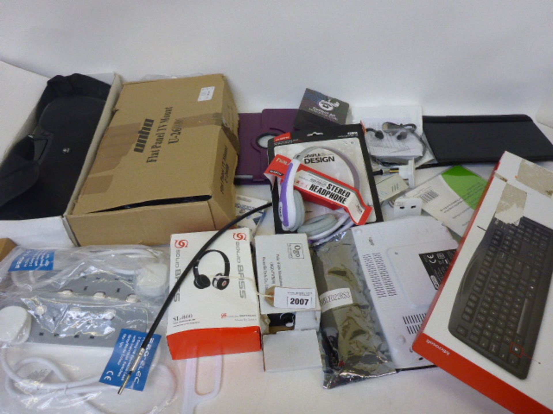 Bag containing TV wall mount, extension leads, pad covers, head phones, keyboard, rechargeable
