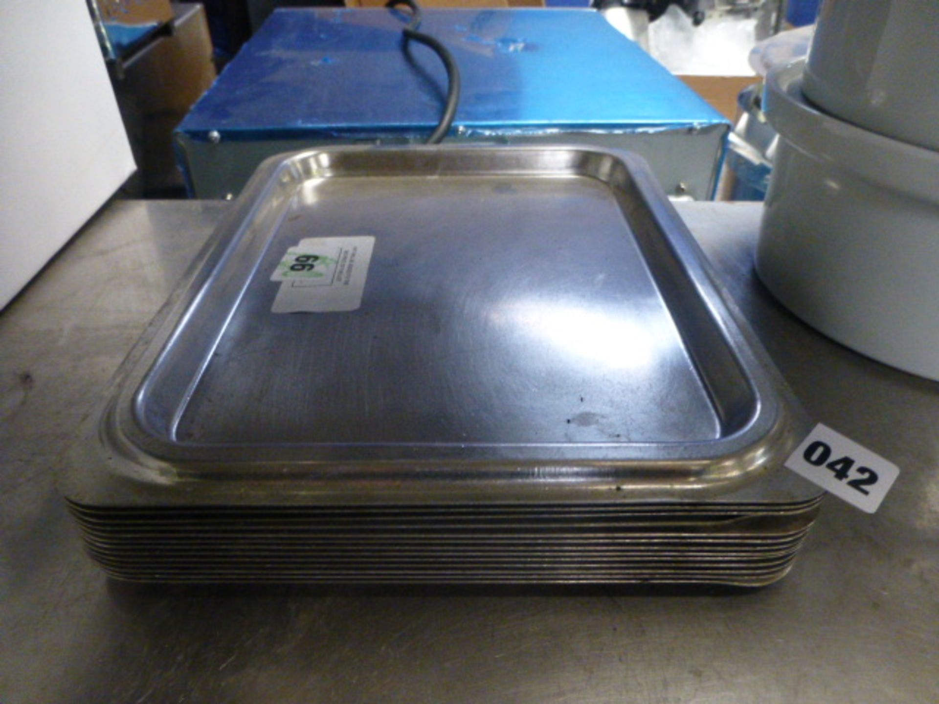 (66) Small stack of stainless steel trays