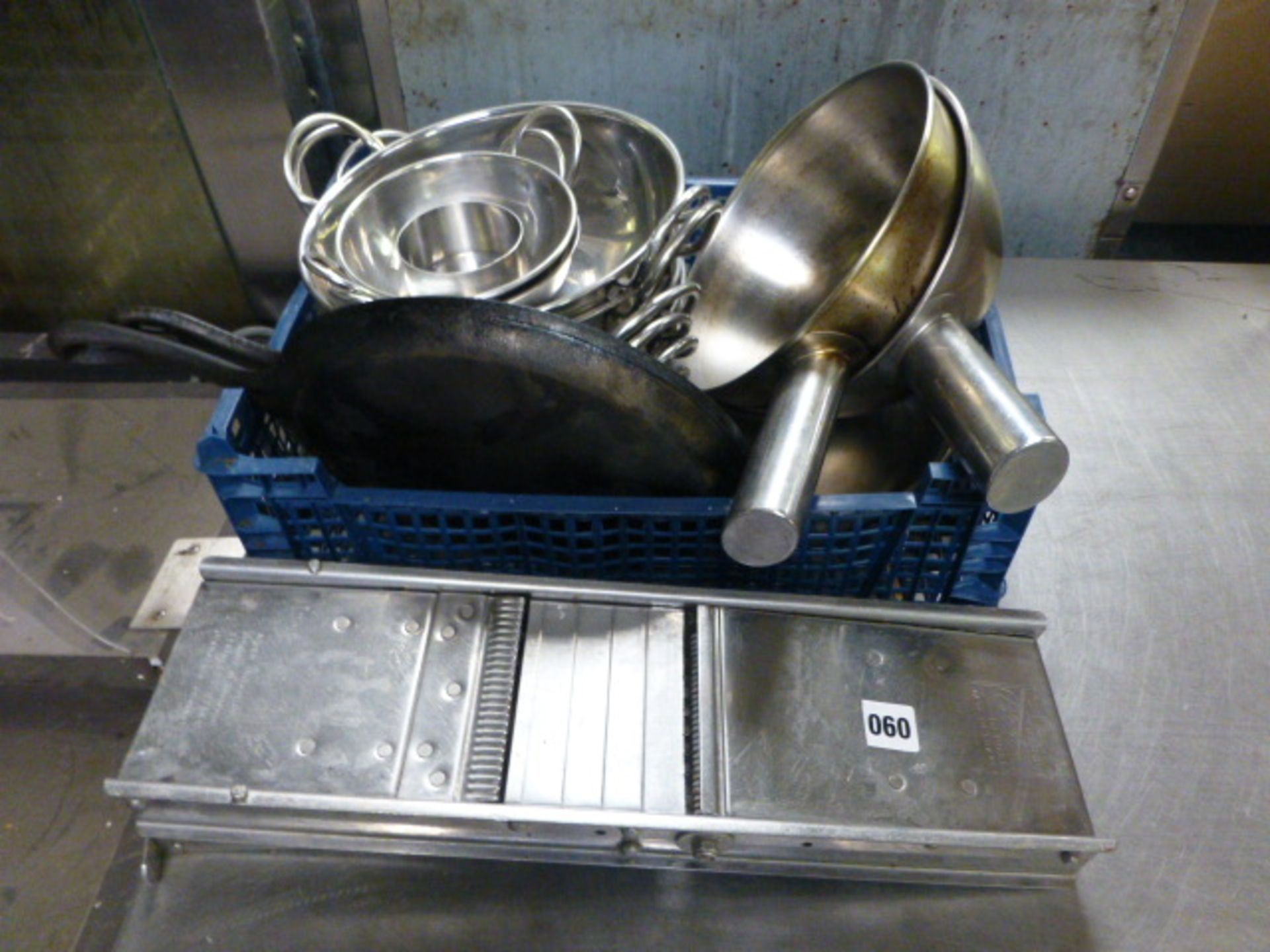 Tray of balti dishes, pans, griddles and mandolin slicer