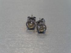 18ct white gold diamond set earrings each set with 0.25ct natural yellow brilliant cut diamond