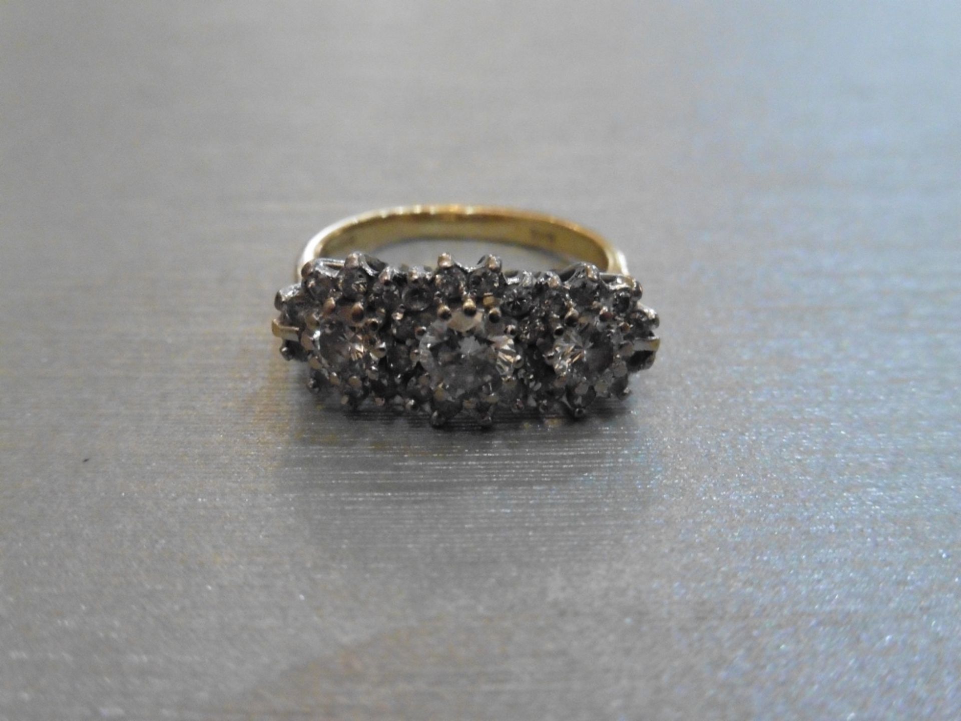 Pre-owned antique style 18ct gold diamond cluster ring.  Set with 3 centred brilliant cut