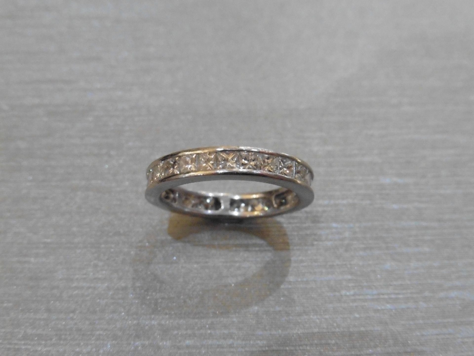 Pre-owned platinum diamond eternity style ring set with princess cut diamonds, weighing 3.60ct in - Image 2 of 3