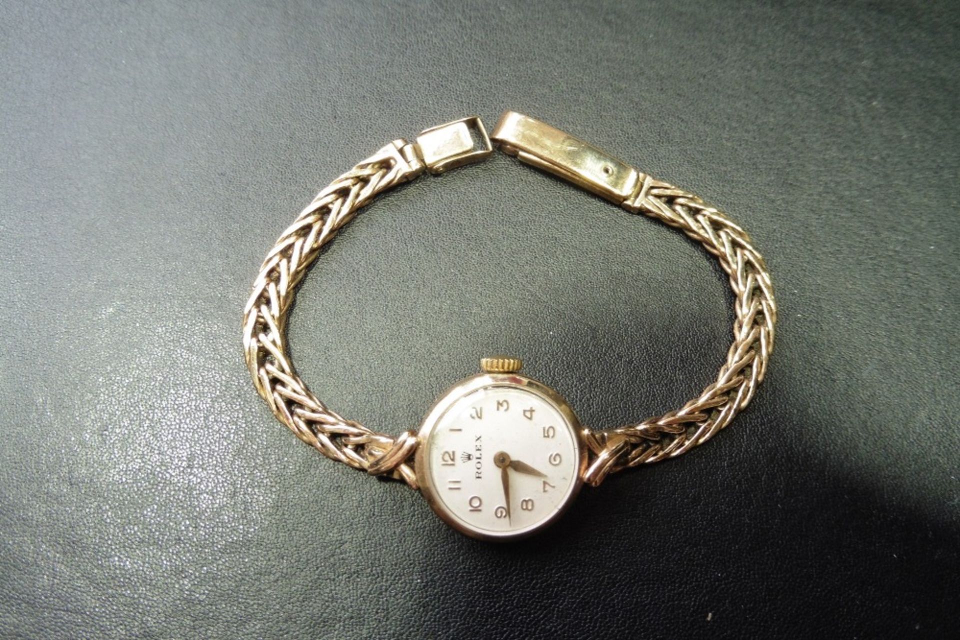 Pre-owned 9ct yellow gold cocktail style ladies rolex watch.  Bracelet strap, Round face with
