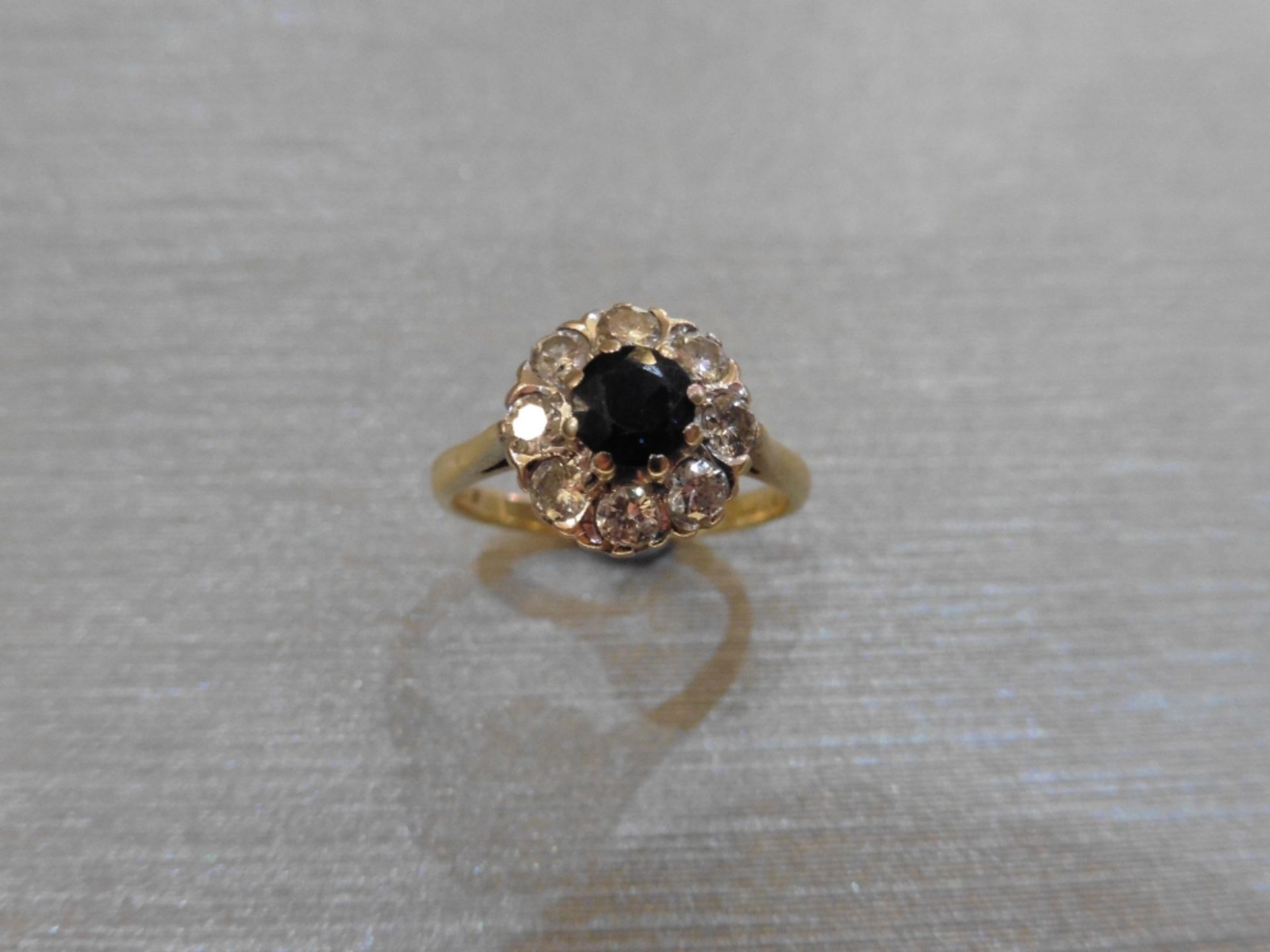 Pre-owned 18ct gold sapphire and diamond cluster ring set with a round sapphire measuring - Image 4 of 4