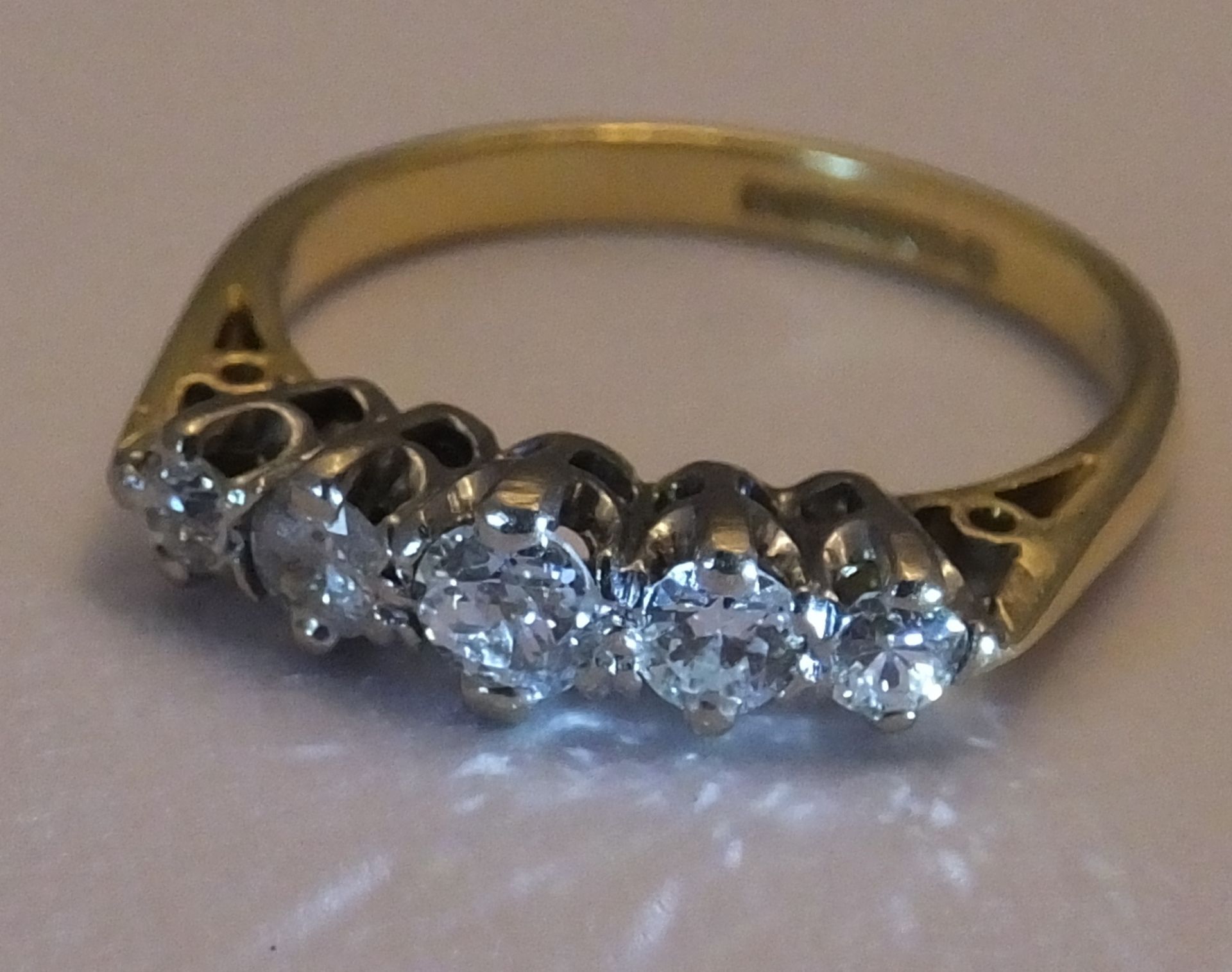 An 18ct gold diamond five-stone ring. Size J. The graduated old-cut diamond line, to the tapered - Image 3 of 3