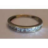 A 9ct gold half eternity ring, with around .33ct of diamonds - size p/q