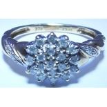 A 9ct gold diamond cluster ring. To include a brilliant-cut diamond cluster ring with diamond