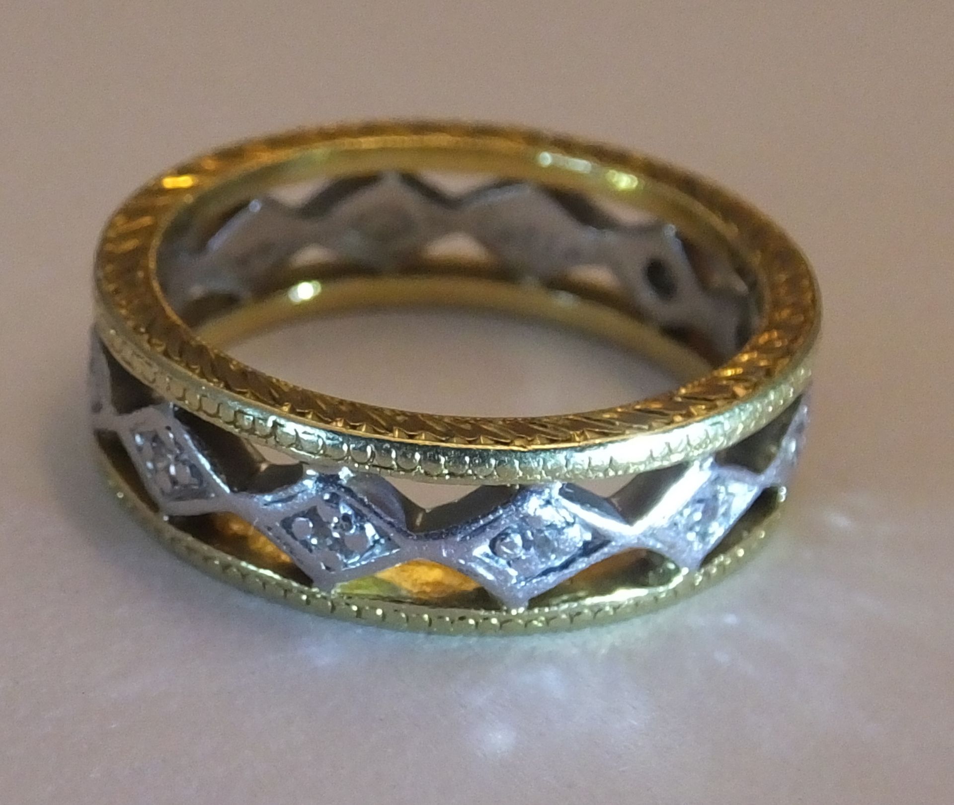 A 18CT Gold diamond full-circle eternity ring. Of bi-colour openwork design, the brilliant-cut - Image 3 of 3