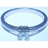 A platinum diamond ring  with a square-shape diamond Estimated total diamond weight 0.30ct,