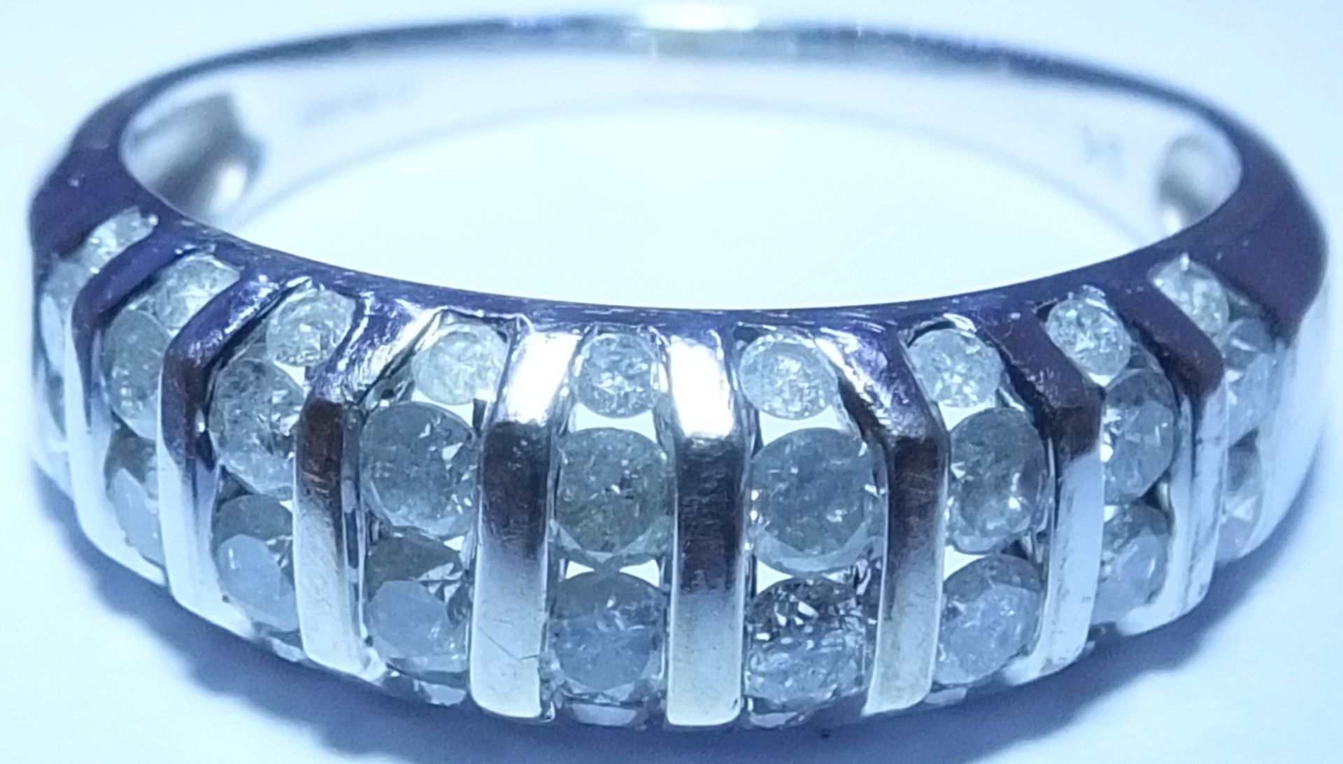 A 9ct White gold diamond  ring. With a pave-set diamond tapered band ring. Estimated total diamond