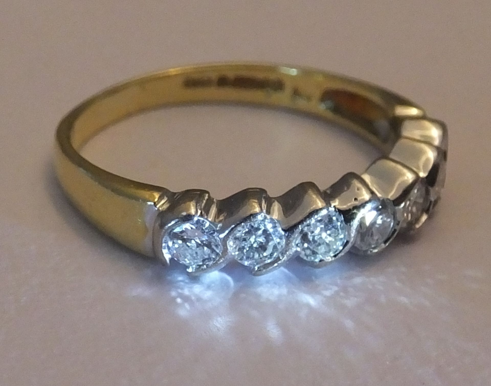 An 18ct gold diamond seven-stone ring. Each brilliant-cut diamond, within a curved spacer, to the - Image 3 of 3