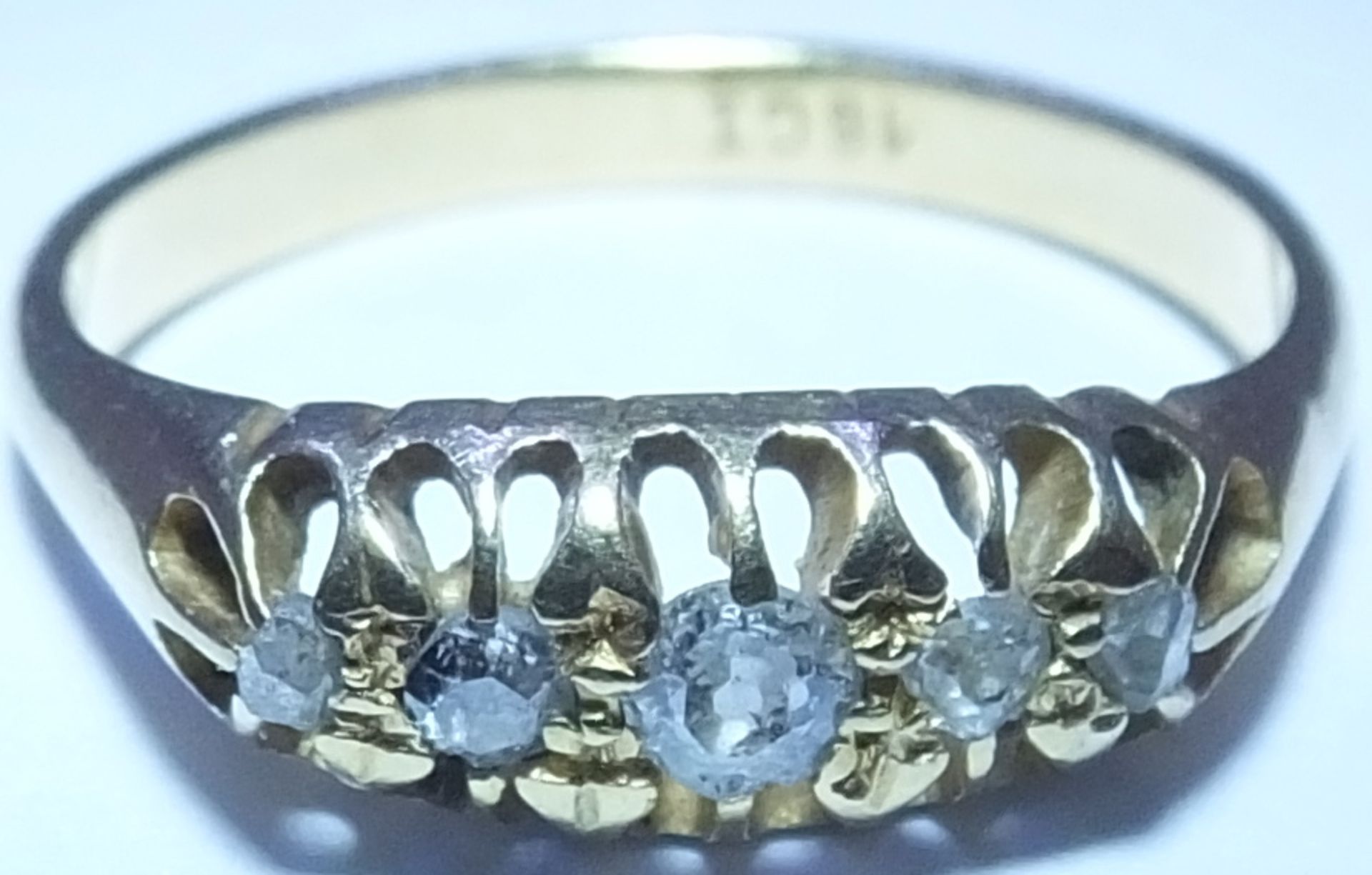 An early 20th century 18ct gold five-stone ring. Designed as a graduated circular-cut diamond