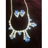 Vintage costume necklace with matching clip on earrings set with sparkling blue stones