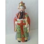 Handpainted chinese figure standing at approx 22cm tall. Condition - Good, no obvious damage.