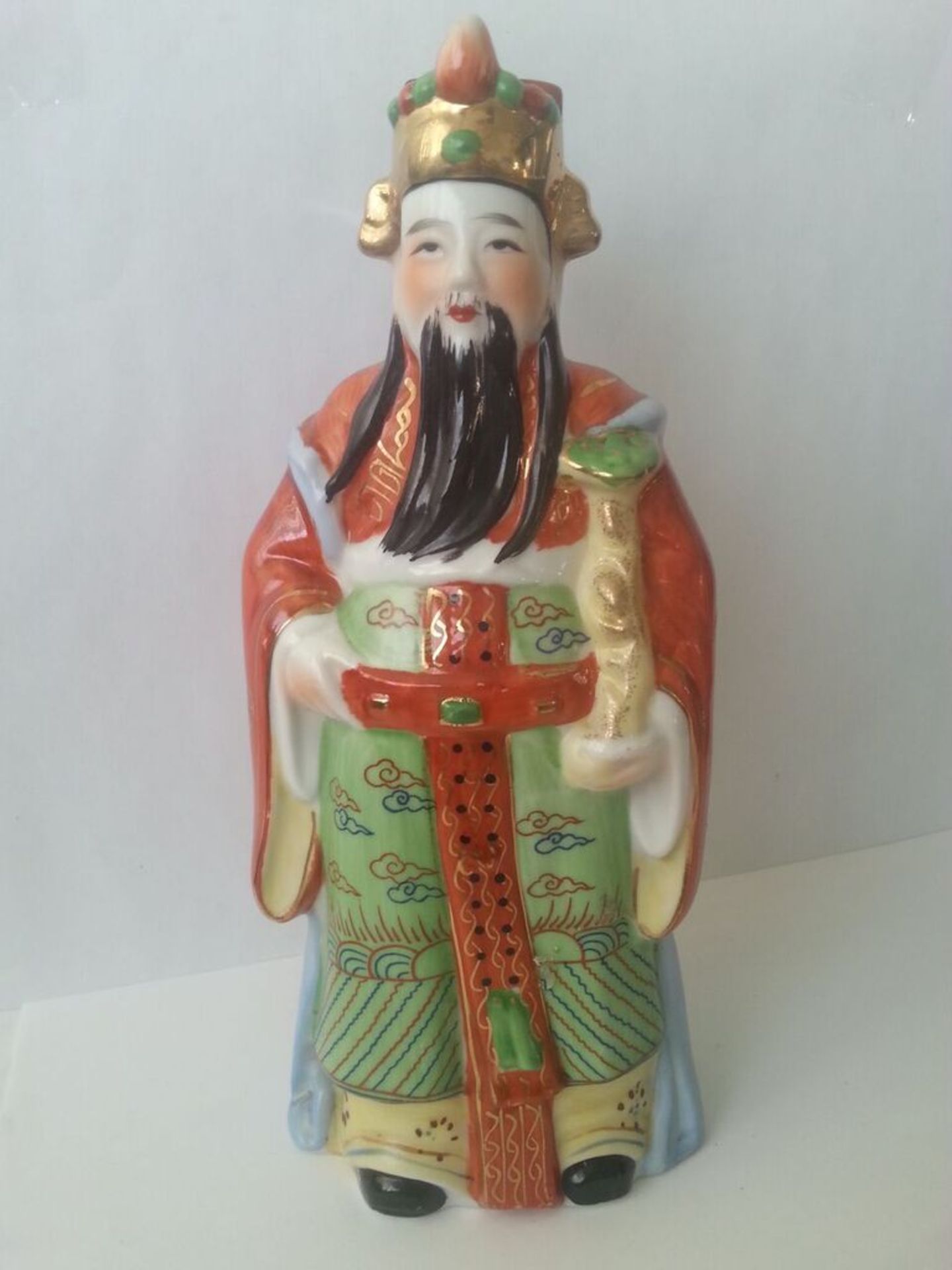 Handpainted chinese figure standing at approx 22cm tall. Condition - Good, no obvious damage.