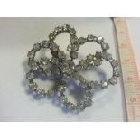 White stone set daisy brooch