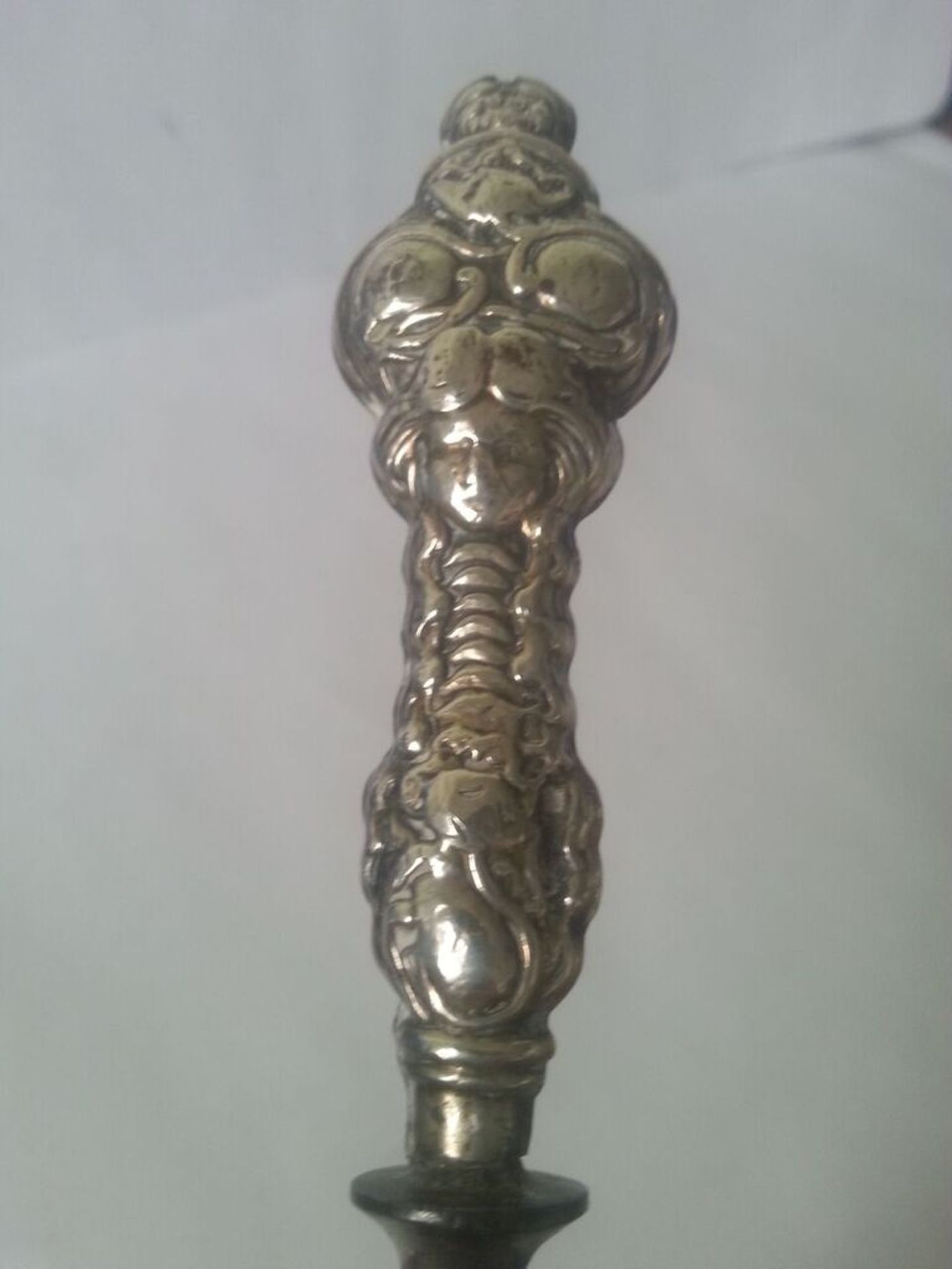 An interesting antique white metal two prong fork, no identifying hallmarks but intricately - Image 2 of 3