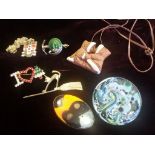 Group of quirky vintage jewellery to include signed Eija Canada Eskimo pendant, Semmering souvenir