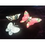 Three butterfly brooches