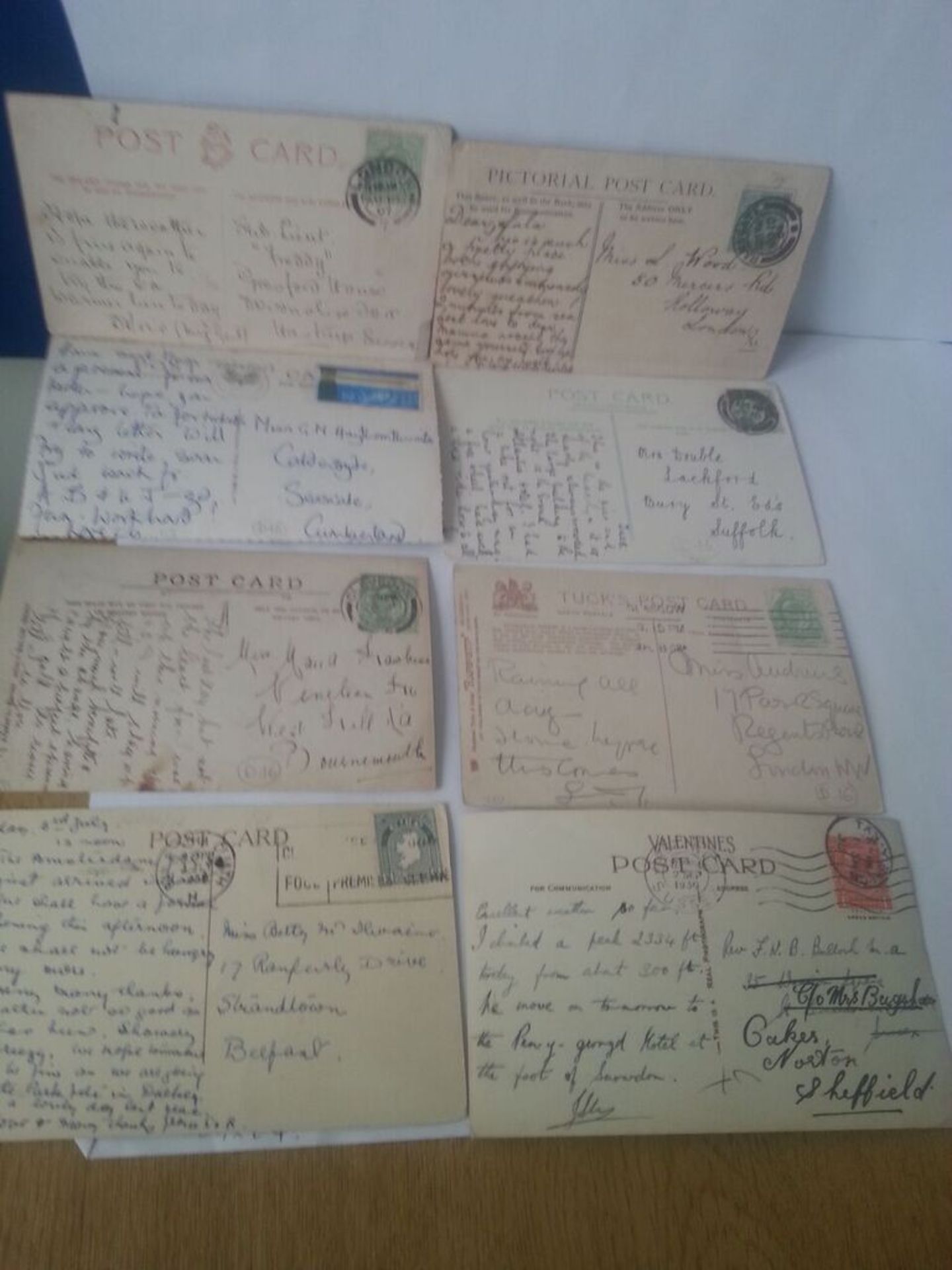 Collection of 15 vintage used postcards with handwriting and stamps