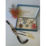 A group of vintage items to include a French Art Deco watch, pendant with amber coloured stone,