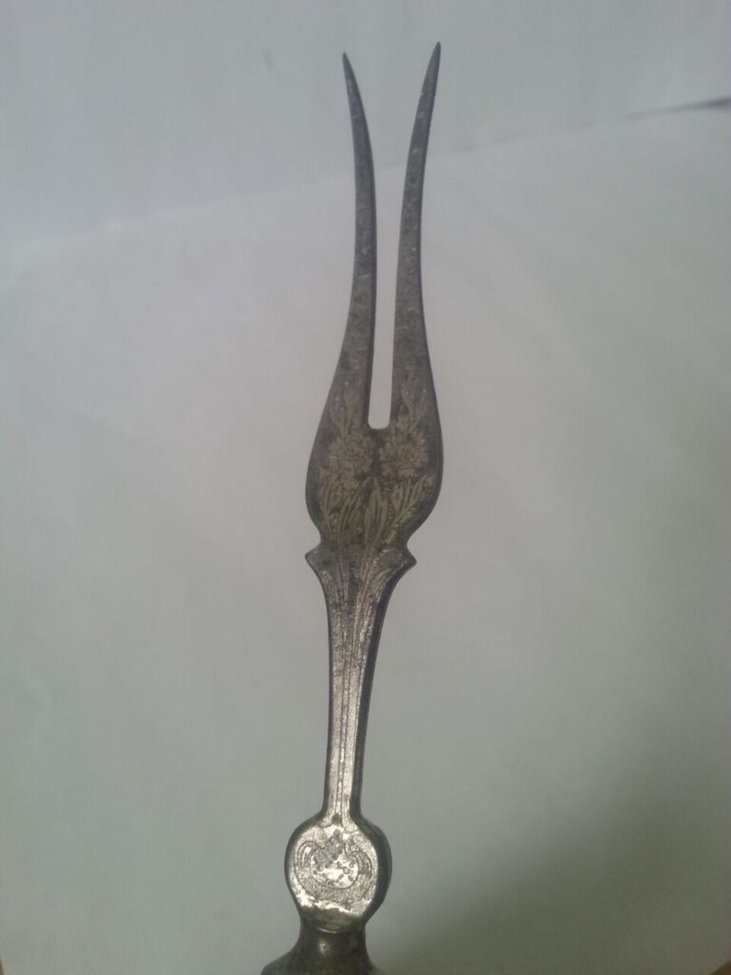 An interesting antique white metal two prong fork, no identifying hallmarks but intricately - Image 3 of 3