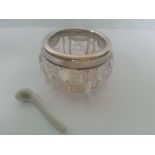 Silver collared cut glass salt hallmarked Chester 1918 with spoon