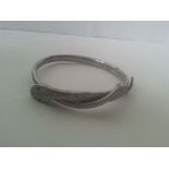 White metal bangle in the form of a snake. Marked "R 37"