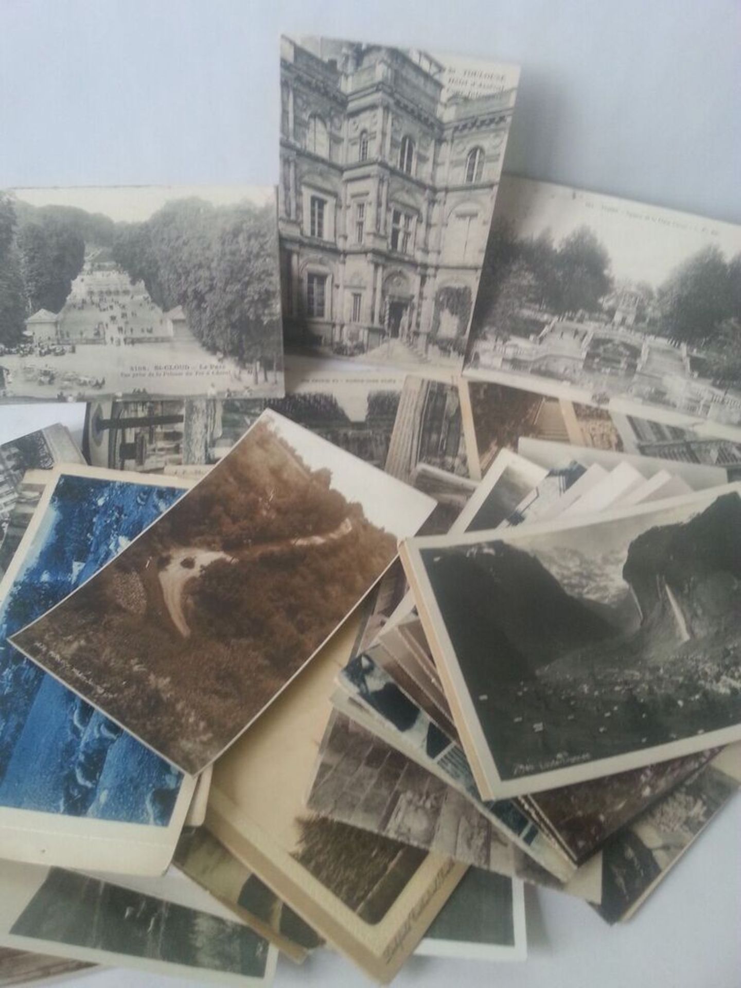 Collection of approximately 50 black & white topographical postcards, mostly French.