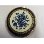 Vintage Stratton compact with blue & white floral decoration, round shape.