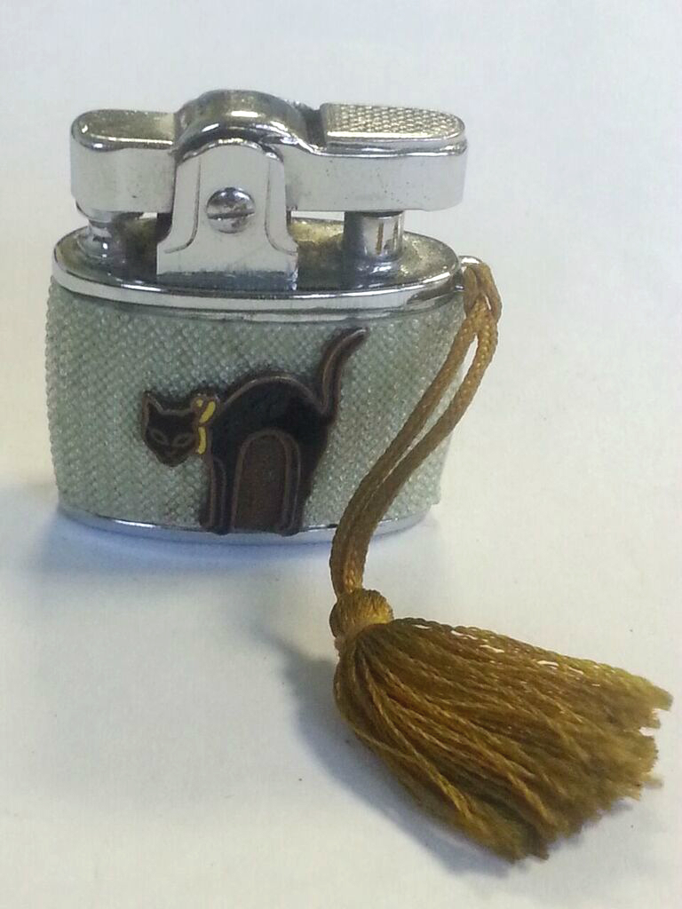 Collectable vintage lighter with enamel black cat and tassle