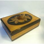 Wooden box with carved floral decoration and a large key inside (box measures 16x22x6cm)