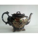 Flamboyant VICTORIAN teapot, jet black glaze handpainted in showy gold with green ivy. This is a