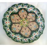 Flamboyant Turkish wall plate with raised decoration having a diameter of approx 25cm. Condition -