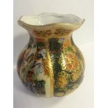 Small chinese hand painted porcelain vase having fluted top and enamelled decoration. Printed