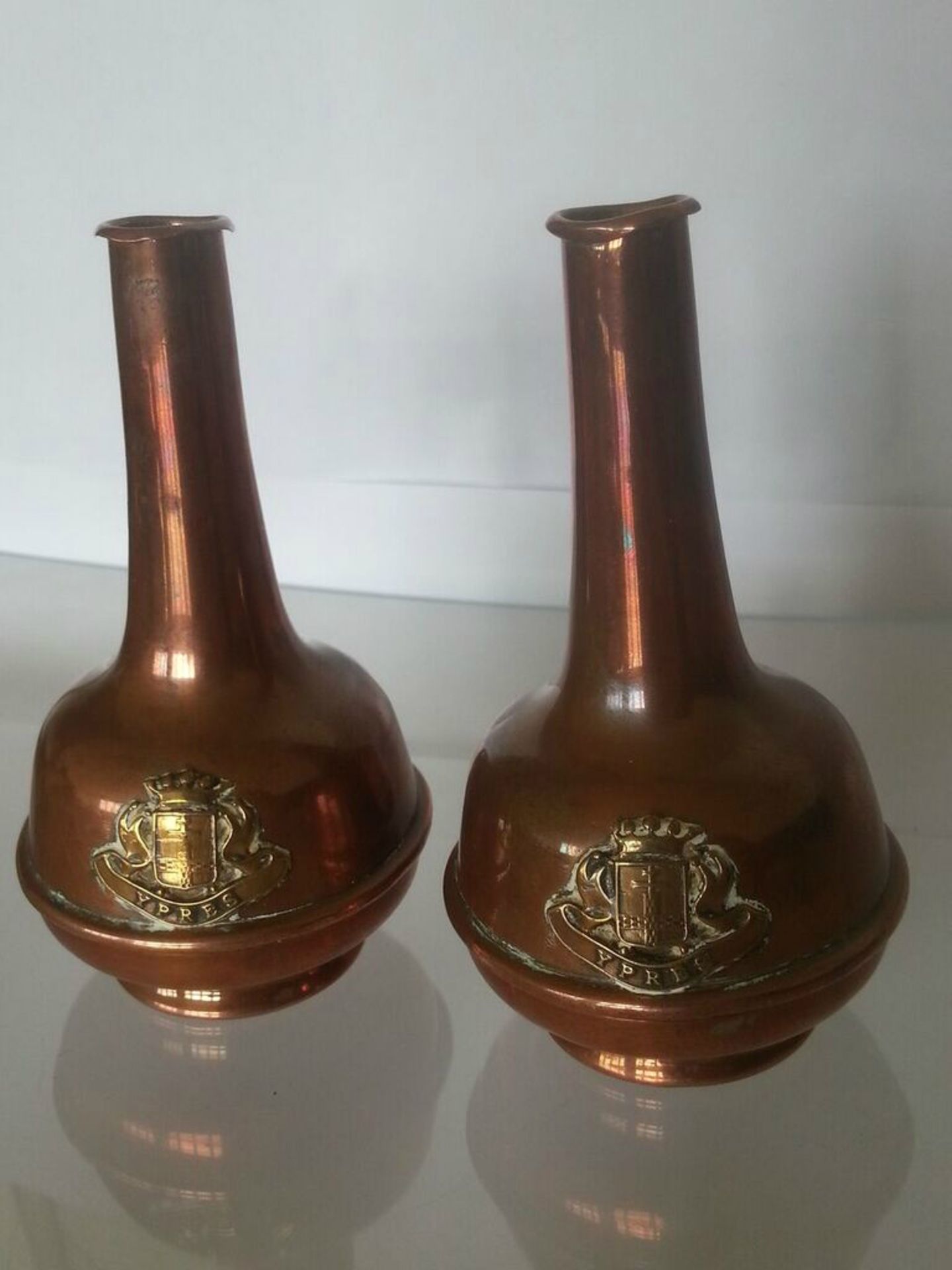 A PAIR OF WWI SOUVENIR OR TRENCH ART VASES WITH CREST OF YPRES. A super pair, copper & brass. Each