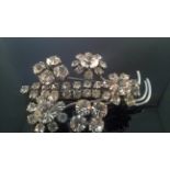 CHARMING VINTAGE BROOCH OF CLEAR CRYSTAL FLOWERS This is a very charming vintage brooch in the