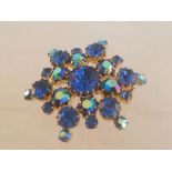 Vintage blue crystal brooch, approx 4.5cm at widest point. Set with beautiful blue round cut stones.