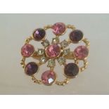 Vintage crystal brooch, approx 3.5cm at widest point. Set with beautiful pink, purple & white