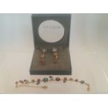 Boxed Pilgrim jewellery set comprising bracelet and earrings.