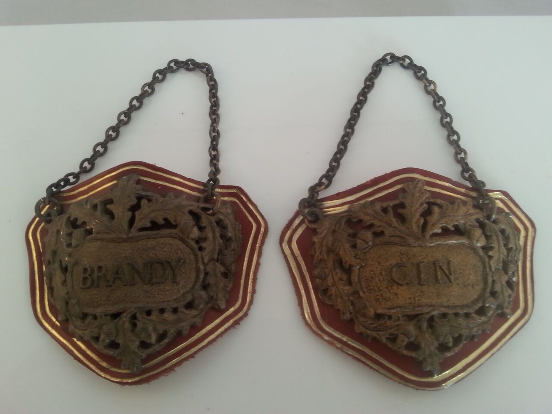 Good pair of metal on leather spirit decanter labels - GIN & BRANDY with oak leaves and acorns to