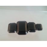 Fabulous vintage brooch set with four octagonal cut black stones. Approx 5.5cm. Low cost delivery