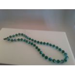 Fabulous 1950s vintage green crystal aurora borealis single string choker with screw clasp. Total