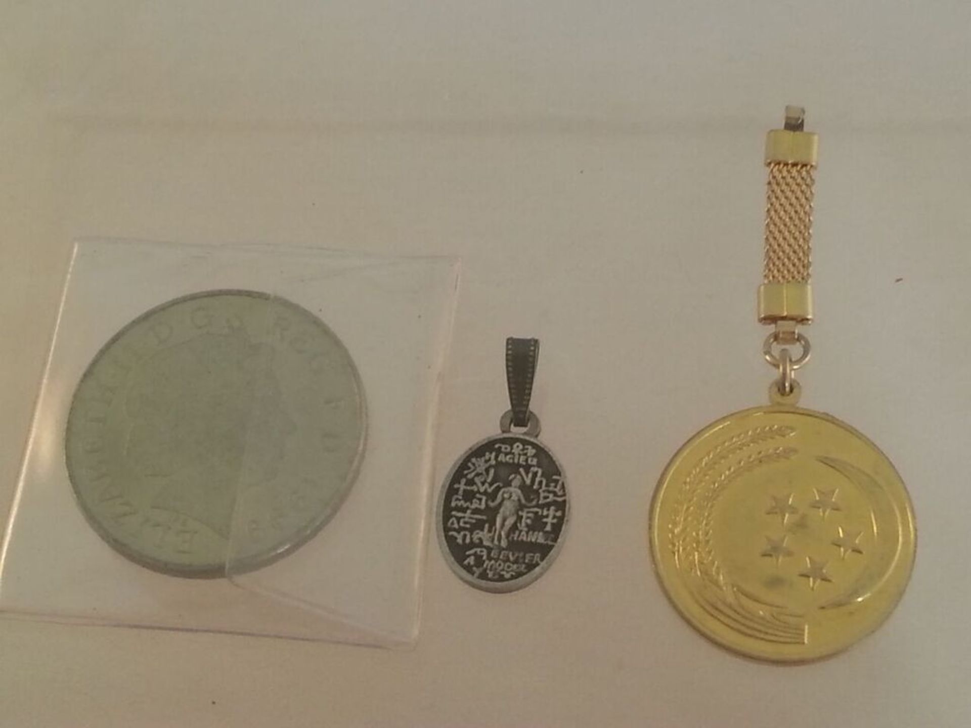 Small group of interesting coins and pendants to include Commemorative LADY DIANA FIVE POUND COIN. - Image 2 of 2