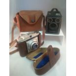 TWO VINTAGE CAMERAS WITH CARRY CASES. Low cost delivery available on all items. This is a low start,