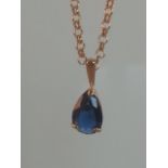 Hallmarked 9ct gold necklace with exquisite pear drop blue sapphire pendant. The chain measures 16