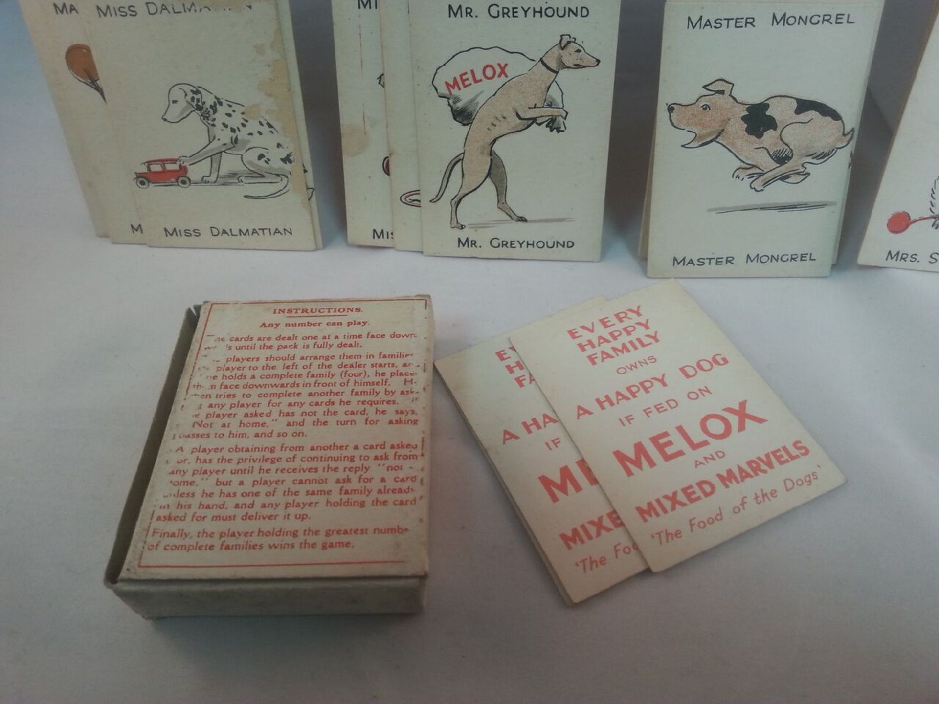 ANTIQUE MELOX HAPPY DOG FAMILIES CARD GAME - COMPLETE IN BOX. A scarce card game, originally - Image 2 of 2